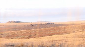 image of open autumn orange brown moorland with rocky exposed hill tops